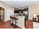 Eat-in kitchen featuring granite countertops, dark wood cabinets, stainless steel appliances and breakfast bar at 7325 Overmountain Dr, Rock Hill, SC 29732