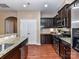 Modern kitchen featuring granite countertops, stainless appliances, and dark wood cabinetry at 7325 Overmountain Dr, Rock Hill, SC 29732