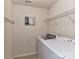 Efficient laundry room with modern washer and dryer, shelving, and wall art at 7325 Overmountain Dr, Rock Hill, SC 29732