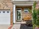 Inviting front entry featuring a covered porch area with a bench and brick accents near garage at 7325 Overmountain Dr, Rock Hill, SC 29732