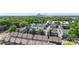 An aerial view of a neighborhood near trees with the city skyline in the distance at 743 Anderson St, Charlotte, NC 28205