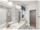 Bright bathroom with double sinks, vanity, and a walk-in shower at 743 Anderson St, Charlotte, NC 28205