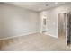 Cozy bedroom with a carpet and a door to the bathroom at 743 Anderson St, Charlotte, NC 28205