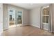 Light-filled bedroom with a sliding door to a balcony and a window with stylish curtains at 743 Anderson St, Charlotte, NC 28205