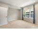 Cozy bedroom with a carpet and a large window at 743 Anderson St, Charlotte, NC 28205