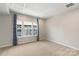 Cozy bedroom with a carpet and a large window at 743 Anderson St, Charlotte, NC 28205