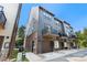 Modern townhome features a private balcony, a single-car garage, and a contemporary design at 743 Anderson St, Charlotte, NC 28205