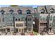 Three-story townhomes showcase brick and siding exteriors, with well-maintained landscaping at 743 Anderson St, Charlotte, NC 28205