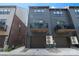Modern townhome features a private balcony, a single-car garage, and a contemporary design at 743 Anderson St, Charlotte, NC 28205