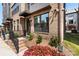 Charming brick townhome with a welcoming front entrance, flower bed and small, manicured landscaping at 743 Anderson St, Charlotte, NC 28205