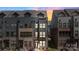 Beautiful three-story townhome featuring a brick and siding facade and a welcoming entrance at 743 Anderson St, Charlotte, NC 28205