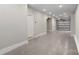 Spacious garage with neutral paint, sealed floors, a garage door, and a service door at 743 Anderson St, Charlotte, NC 28205