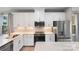 Modern kitchen with stainless steel appliances, white cabinetry, and quartz countertops at 743 Anderson St, Charlotte, NC 28205