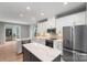 Stylish kitchen with white cabinetry, stainless steel appliances, and a center island at 743 Anderson St, Charlotte, NC 28205