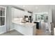 Bright, modern kitchen featuring white cabinets, stainless steel appliances, and a center island at 743 Anderson St, Charlotte, NC 28205