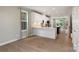Bright kitchen featuring stainless steel appliances, a center island, and wood floors at 743 Anderson St, Charlotte, NC 28205