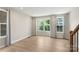 Bright living room with many windows and light-colored wood floors at 743 Anderson St, Charlotte, NC 28205