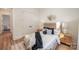 Cozy bedroom featuring a comfortable bed, modern decor, and ample natural light from the windows at 919 Village Lake Dr, Monroe, NC 28110