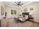 Serene bedroom with large windows, a tray ceiling, and a comfortable bed with decorative pillows at 919 Village Lake Dr, Monroe, NC 28110