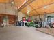 Spacious barn interior with high ceilings, ceiling fan, and ample storage space for equipment at 925 Hamilton Rd, Chester, SC 29706