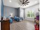 Well-lit bedroom featuring two twin beds, a large window, and light-colored wood floors at 925 Hamilton Rd, Chester, SC 29706