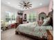 Charming bedroom featuring a large bed, bright windows, and ample natural light at 925 Hamilton Rd, Chester, SC 29706