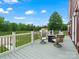 Relaxing deck with seating area overlooks the lush green lawn and serene landscape at 925 Hamilton Rd, Chester, SC 29706
