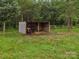 Small horse shelter with two horses inside, providing a shady retreat in a lush, green field at 925 Hamilton Rd, Chester, SC 29706