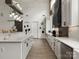 Modern kitchen with white cabinetry, granite countertops, stainless steel appliances, and ample counter space at 925 Hamilton Rd, Chester, SC 29706