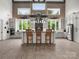 Bright kitchen with white cabinets, a large center island with bar stools, and stainless steel appliances at 925 Hamilton Rd, Chester, SC 29706