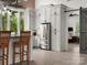 Well-lit kitchen with white cabinets, stainless steel appliances, and a view of the outdoors at 925 Hamilton Rd, Chester, SC 29706