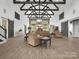 Spacious living room featuring high ceilings, wooden beams, and an open layout with lots of natural light at 925 Hamilton Rd, Chester, SC 29706