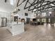 Spacious living room with an open floor plan, modern lighting, and beautiful wood floors at 925 Hamilton Rd, Chester, SC 29706