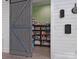 Pantry featuring blue sliding barn door and ample shelving for food storage at 925 Hamilton Rd, Chester, SC 29706