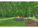 Charming backyard sitting area with chairs, perfect for relaxation and enjoying the peaceful surroundings at 9520 Squirrel Hollow Ln, Charlotte, NC 28270