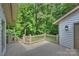 Home's deck overlooking lush greenery at 9520 Squirrel Hollow Ln, Charlotte, NC 28270