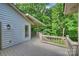 Home's deck overlooking lush greenery at 9520 Squirrel Hollow Ln, Charlotte, NC 28270
