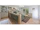 Bright living room boasts hardwood floors, fireplace, built-ins, and access to a covered porch at 9520 Squirrel Hollow Ln, Charlotte, NC 28270