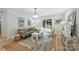 Cozy living room with stylish decor, modern lighting, and sliding doors to a deck at 9520 Squirrel Hollow Ln, Charlotte, NC 28270