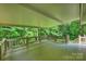 This spacious porch offers a perfect space to unwind with serene views of the surrounding trees and greenery at 9520 Squirrel Hollow Ln, Charlotte, NC 28270