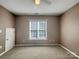 Bedroom with neutral carpet, and a standard window at 10319 Willingham Rd, Huntersville, NC 28078