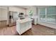 Bright modern kitchen with stainless appliances, white cabinets, and marble counters at 10319 Willingham Rd, Huntersville, NC 28078