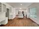Open kitchen with stainless steel appliances, an island, and white cabinets at 10319 Willingham Rd, Huntersville, NC 28078