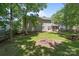 View of the backyard featuring a lush lawn and the exterior of the home at 10327 Shelter Rock Ct, Charlotte, NC 28214