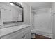 The bathroom showcases a marble countertop vanity, framed mirror and combination bathtub and shower at 10327 Shelter Rock Ct, Charlotte, NC 28214