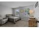 Cozy bedroom features natural light from dual windows, neutral walls, and comfortable carpeting at 10327 Shelter Rock Ct, Charlotte, NC 28214