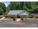 Community clubhouse featuring ample parking and a welcoming entrance at 10327 Shelter Rock Ct, Charlotte, NC 28214
