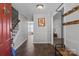 Inviting entryway with hardwood floors, a staircase, and a coat rack at 10327 Shelter Rock Ct, Charlotte, NC 28214