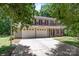 Attractive two-story home featuring a two-car garage, red shutters, and a well-maintained lawn at 10327 Shelter Rock Ct, Charlotte, NC 28214