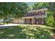 Charming two-story home with red shutters, vinyl siding, a covered porch and a two-car garage at 10327 Shelter Rock Ct, Charlotte, NC 28214